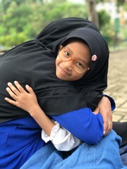 A Tender Embrace Between Mother and Her Little Girl