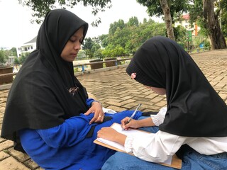 Mom Teaching Her Young Daughter Under Sunny Skies
