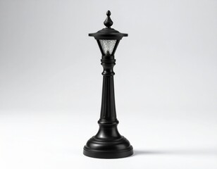 Fototapeta premium Ornate Black Miniature Street Lamp on White Background Still Life