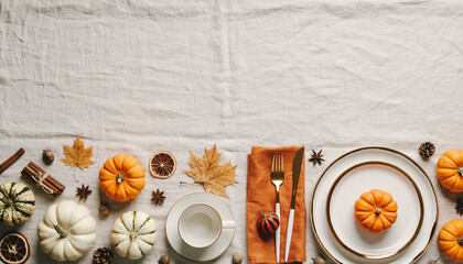 Elegant autumn harvest table setting with small decorative pumpkins, golden cutlery, and fall leaves on a rustic linen tablecloth, perfect for Thanksgiving celebrations and festive seasonal gatherings