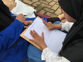 Peaceful Study Time for Muslim Mother and Child