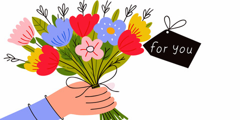 A colorful bouquet of flowers being offered with a for you tag
