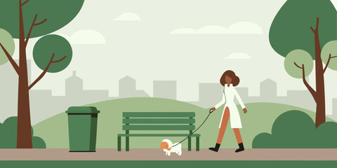 A woman walking her small dog in a serene green urban park setting