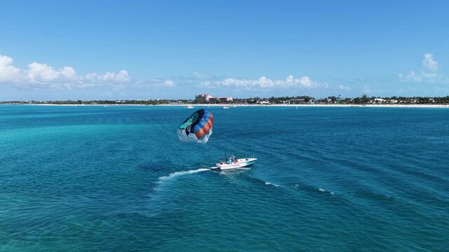 Parasailing At Providenciales In Turks And Caicos. Idyllic Beach. Nature Landscape. Aquatic Sport. Parasailing In Turks And Caicos. Aquatic Sport Landscape.