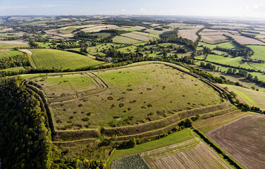 NE over Hod Hill Iron Age hillfort. Blackmore Vale, Dorset. Main rampart dates from 500 BC. Once home of the Durotriges. Later Roman fort in NW corner
