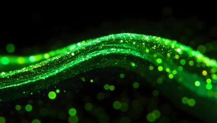 A dynamic wave of glowing green particles flowing against a dark background with bokeh effects