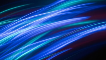 An abstract background of vibrant, curved blue and turquoise light trails moving at high speed, creating a sense of energy, technology, and futuristic motion against a dark backdrop.