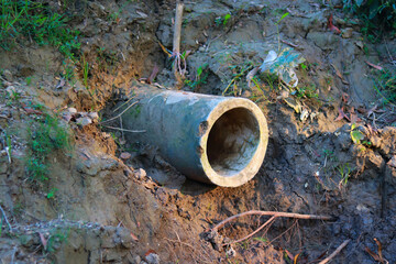 Drainage pipe on the ground in the forest