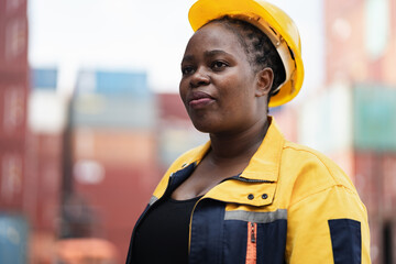 Portrait African woman logistics workers at container site	