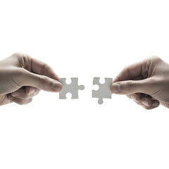 Two hands connecting puzzle pieces against a dark background symbolizing teamwork and connection