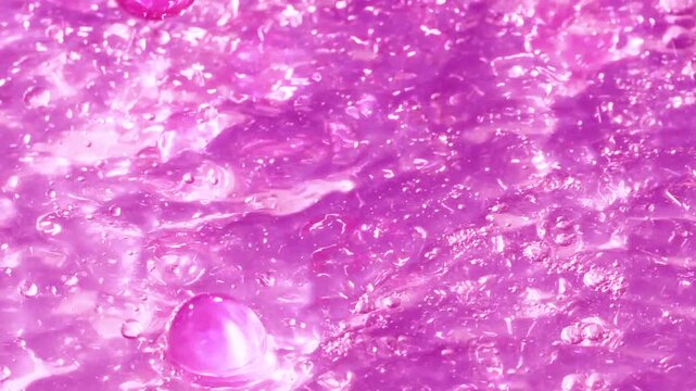 Close-up soap foam texture with pink gel balls, white shampoo soapsud background