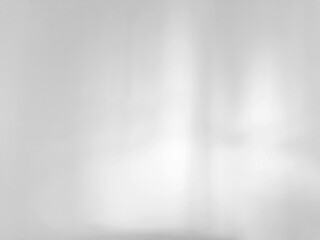 White cement wall background with natural light overlay for graphic design or wallpaper.