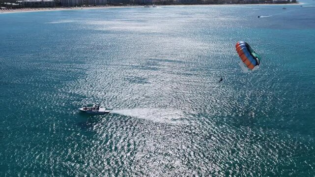 Parasail At Providenciales In Turks And Caicos Islands. Turquoise Beach. Nature Landscape. Wind Sport. Parasail In Turks And Caicos Islands. Wind Sport Landscape.