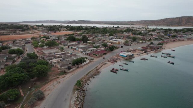 Aerial view of Pueblo de Araya, scenic coastal town by calm water