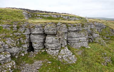 Moking Hurth Cave entrances. Limestone scarp of High Hurth Edge, Upper Teesdale. Important Ice Age environment and cave paleo finds. Human, lynx etc