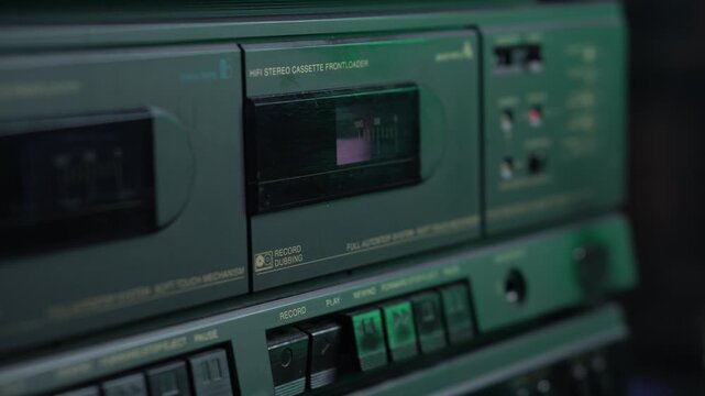 Inserting Pink Audio Cassette Tape and Start Recording Sound, Close Up. Vintage Entertainment System From 1980's