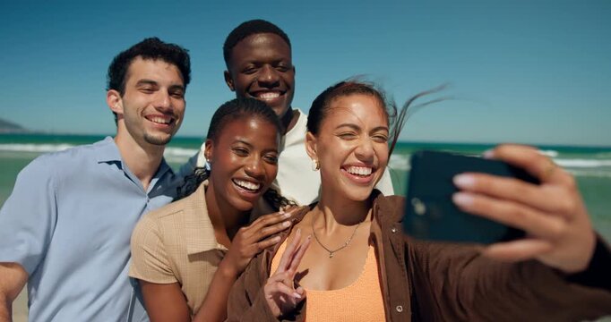 Selfie, happy and friends by beach with peace sign for summer vacation, holiday and weekend together. Outdoor, travel and people with photo by ocean for bonding, relax and memory for social media