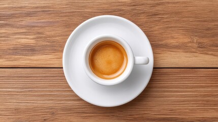 Obraz premium Aerial View of a White Espresso Cup Filled with Rich Dark Coffee on a Rustic Wooden Table Surrounded by Natural Beauty and Warm Ambiance