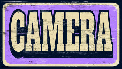 Aged vintage camera sign on wood