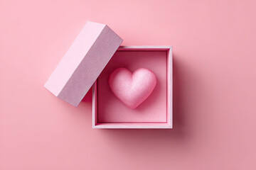 Open gift box with a cute little heart inside on pink background