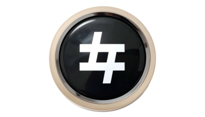 Shiny circular button features a white hashtag symbol on a black glossy surface, framed by gold
