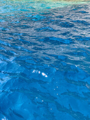 Blue ocean water surface. Rippled sea water background texture, above view