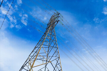 Towering electric poles against the sky