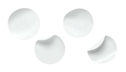 Four white circular objects with two partially peeled edges on a black background