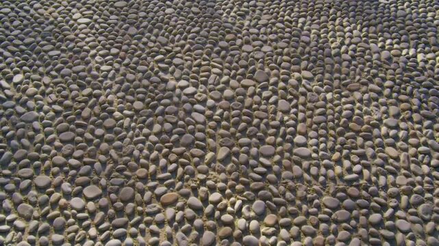 Close up view of a textured pebble surface for backgrounds and designs