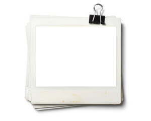 黒いクリップで束ねられた、古いポラロイド写真