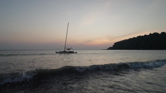 Sailboat Off the Beach of Koh Samui - Sunset Sky with Waves Rolling In