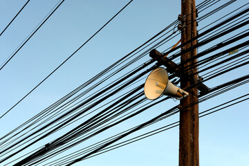 Speaker mounted on a street lamp post.