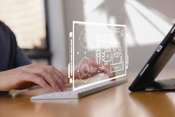 Hands typing on keyboard with holographic interface showing artificial intelligence, automation, data processing, and robotic arm, representing future technology industry