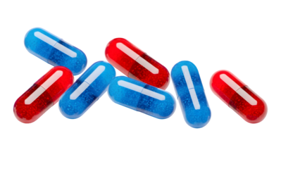 red and blue transparent capsules containing granular substances, scattered on a dark transparent background, representing choices.