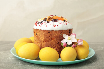 Traditional easter cakes with colorful sprinkles, with eggs on light background.