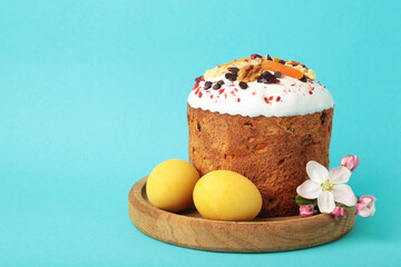 Traditional easter cakes with colorful sprinkles, with eggs, a bunny figurine, and spring flowers, creating a festive holiday scene