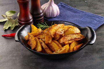 Baked crispy hot potato with rosemary