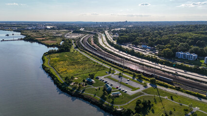 Aerial view of Interstate 495 highway, Northeast Corridor railroad, Fox Point State Park next to Delaware River near Wilmington, Delaware 