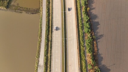 Aerial view of street in Bangkok Thailand with cars and countryside