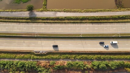Aerial view of street in Bangkok Thailand with cars and countryside