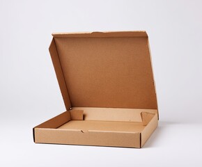 Open cardboard box, brown, on white background, revealing interior, top flap up