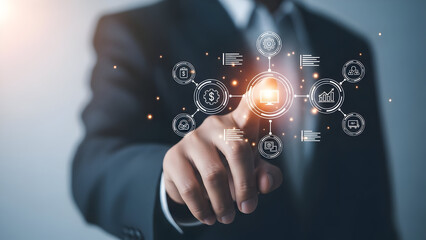 A businessman touches a glowing network of icons representing business growth finance technology and data analysis