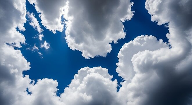blue sky with white puffy clouds on sunny day