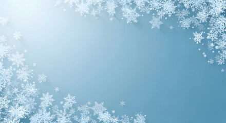 Soft dusty blue winter background featuring diagonal arrangement of delicate white snowflakes perfect for seasonal advertising and festive banners