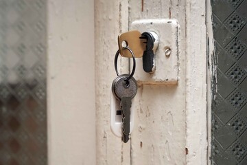 The keys are in the keyhole of the old door