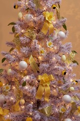 Decorated holiday tree with daffodil ribbon and ornaments