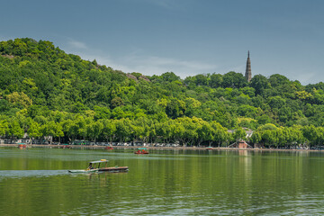 A boat man rows his boat on the West Lake in Hangzhou, Zhejiang Province, China, May 4, 2025