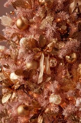 Christmas tree with pink needles and gold decorations