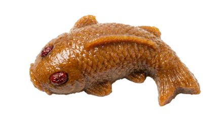 PNG cut out isolated background. A studio shot of a traditional Chinese sticky rice cake, or Nian Gao, molded into the shape of a carp fish.