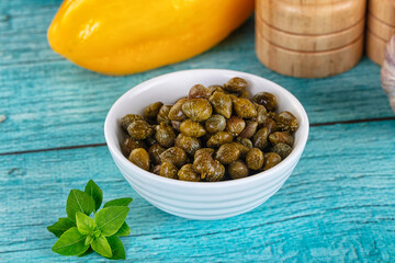 Pickled canned capers in the bowl